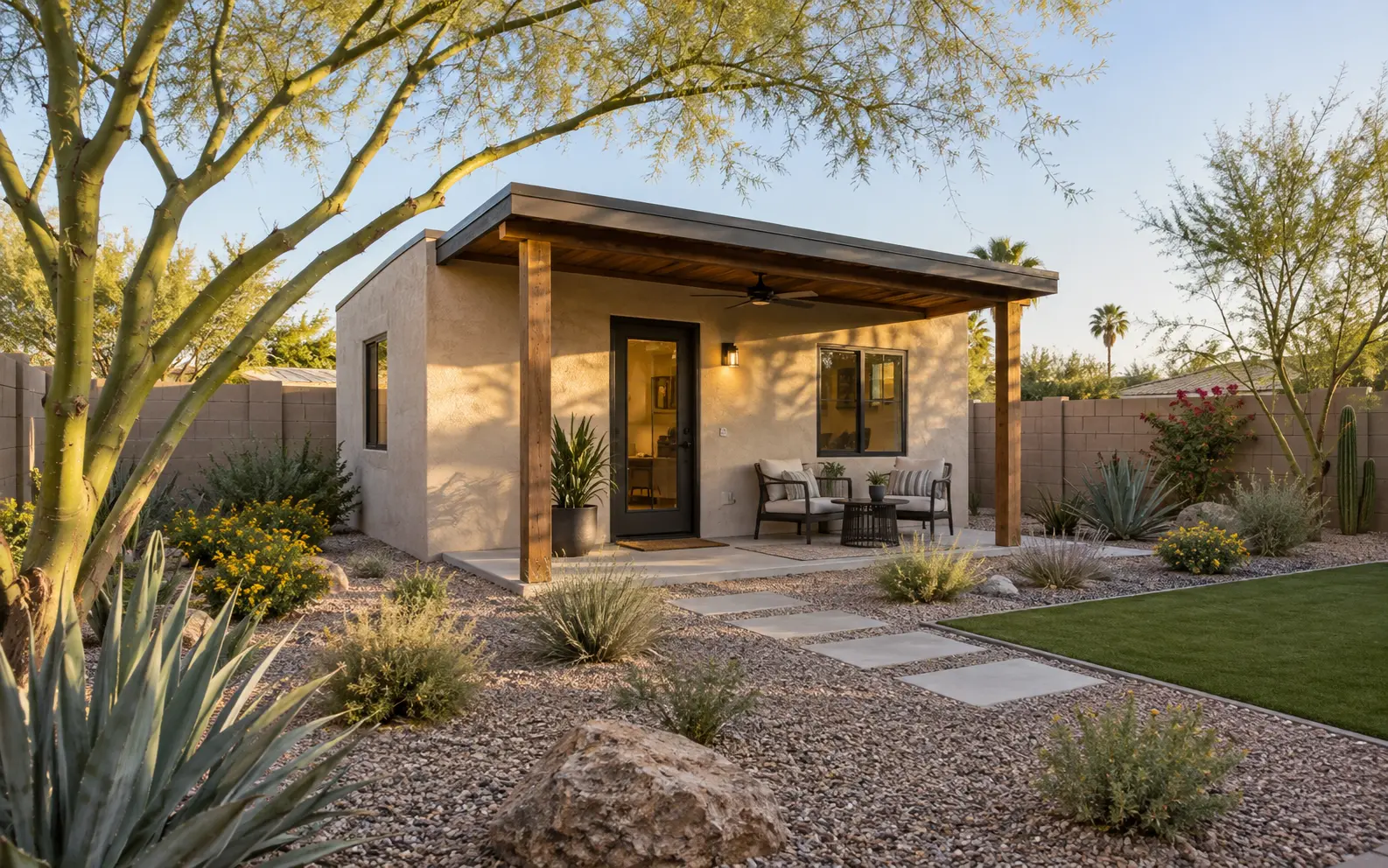 Compact detached backyard casita with a shaded patio and Phoenix desert landscaping